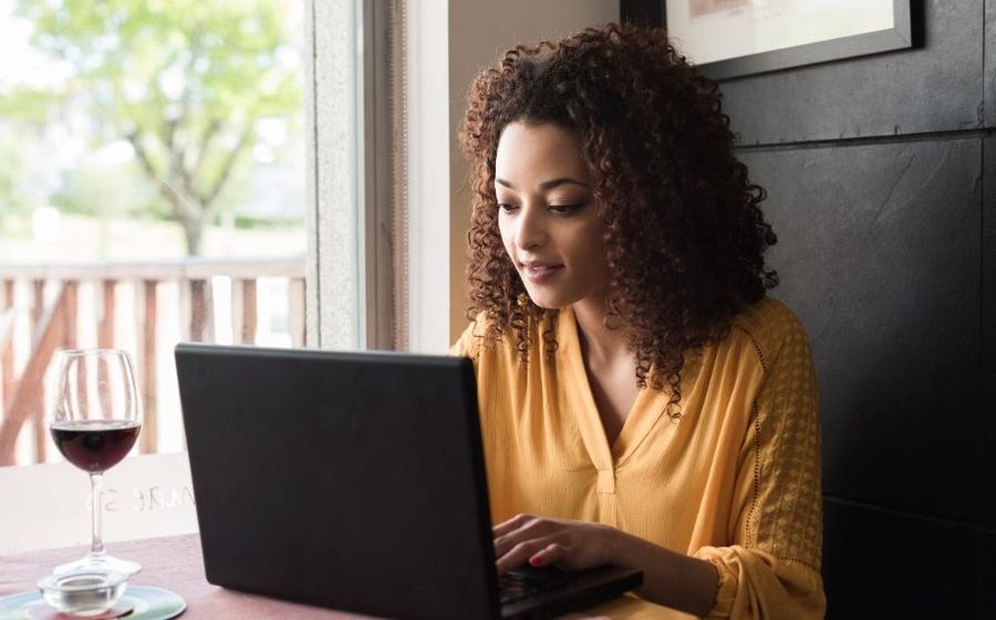 A woman working on her laptop at home